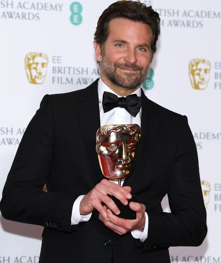 Bradley Cooper holding an award