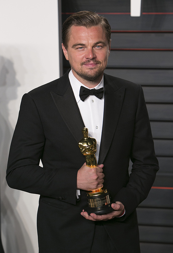 Leonardo DiCaprio holding an Oscar award