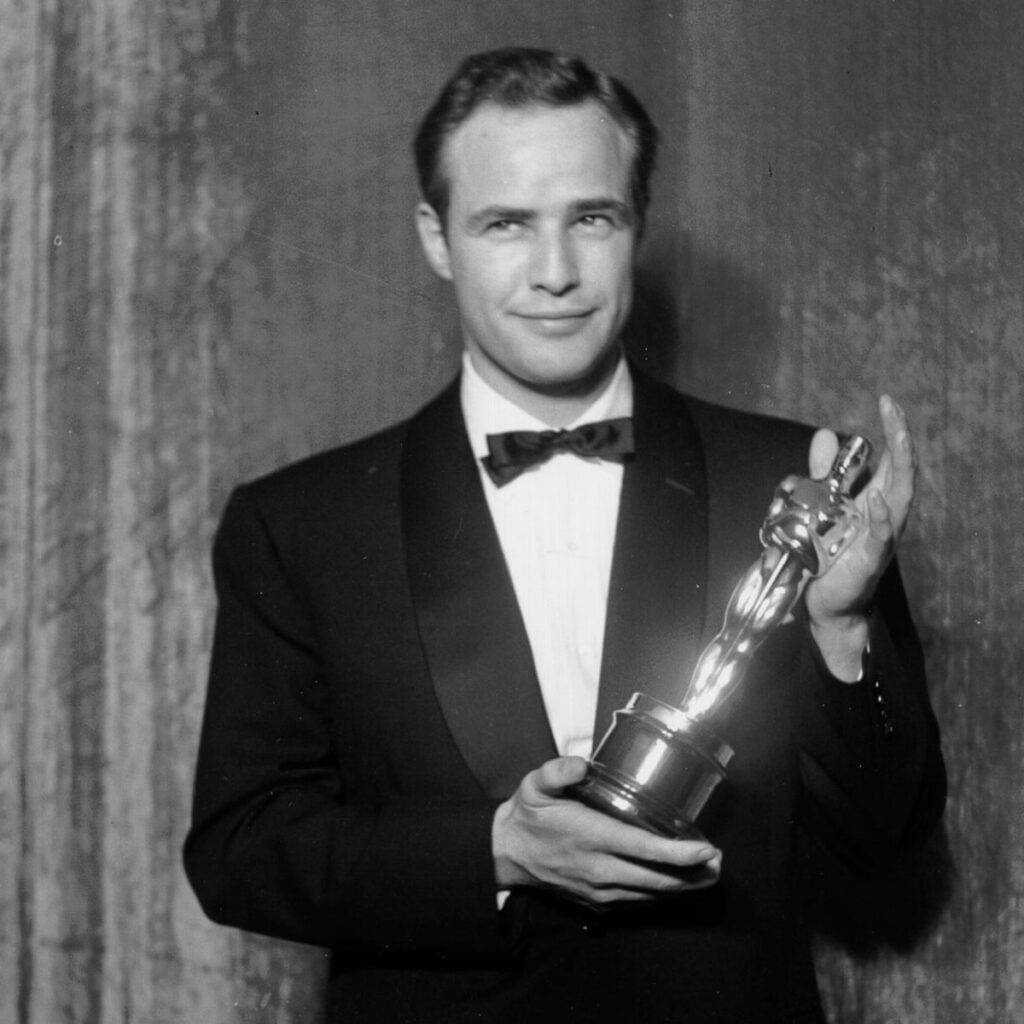 Marlon Brando holding an award